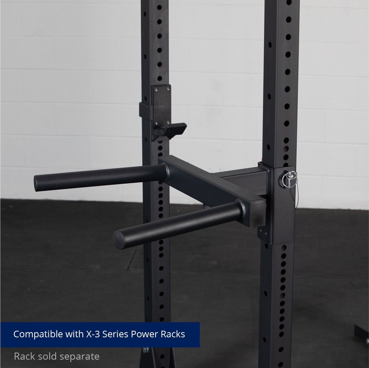 A pair of sturdy, black Titan Fitness X-3 Series Y-Dip Attachments attached to a power rack, declared as compatible with x-3 series power racks, for enhancing workout routines with dip exercises