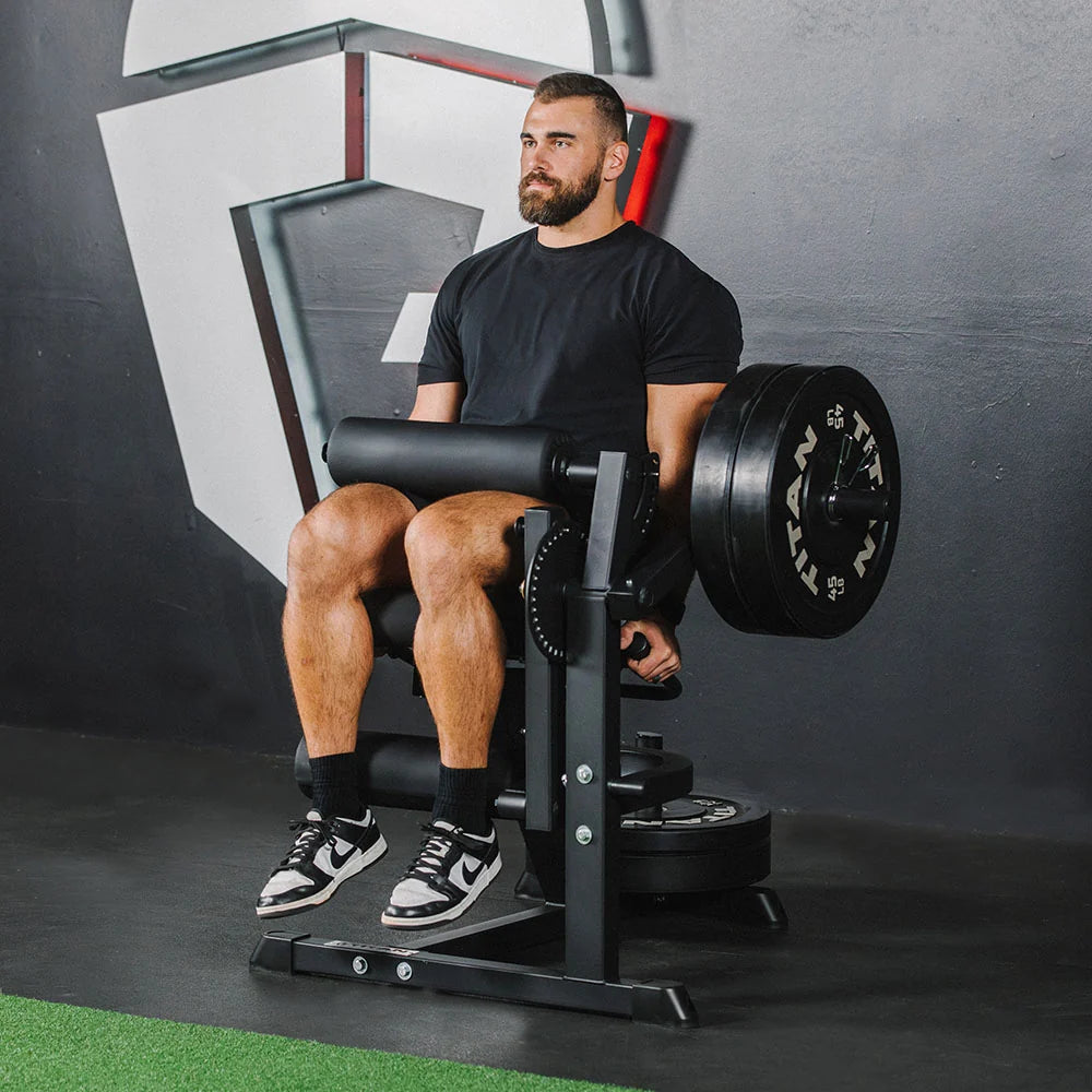 Titan plate-loaded leg extension and leg curl machine, extension position flexed